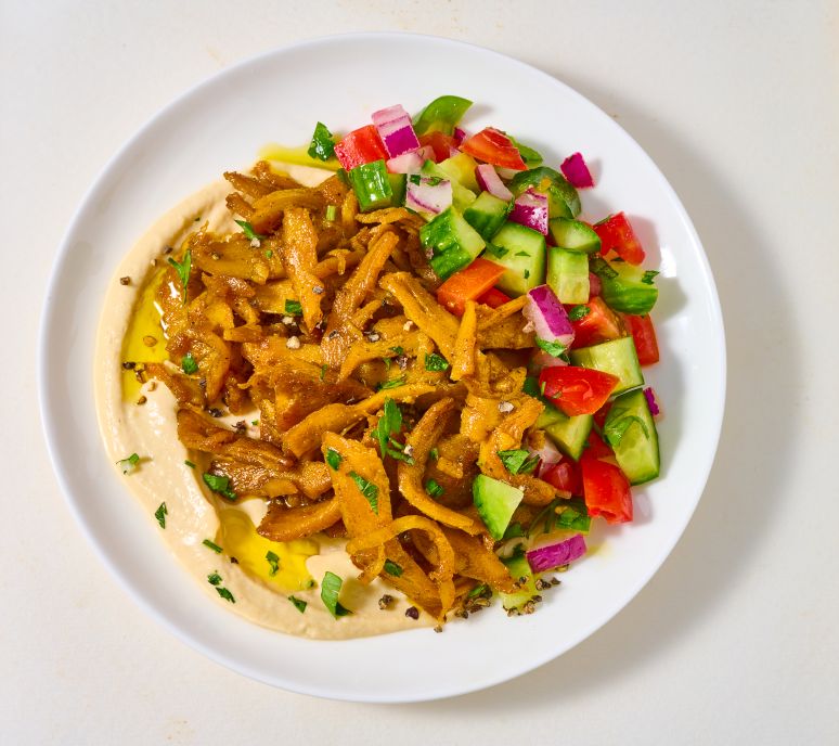Provero shawarma on hummus plate