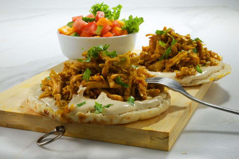 Provero on pita with Israeli salad